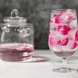 Photo by Charlotte May on <a href="https://www.pexels.com/photo/glass-of-drink-with-rose-petals-near-jar-5946994/" rel="nofollow">Pexels.com</a>